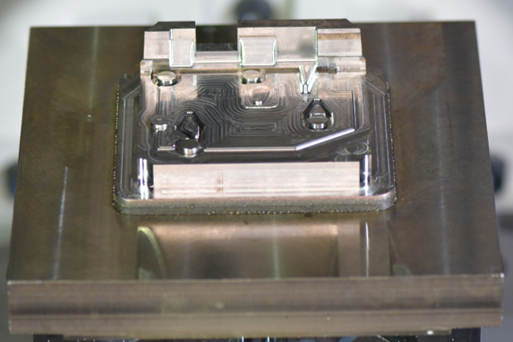 Part in fixture during in-envelope machining